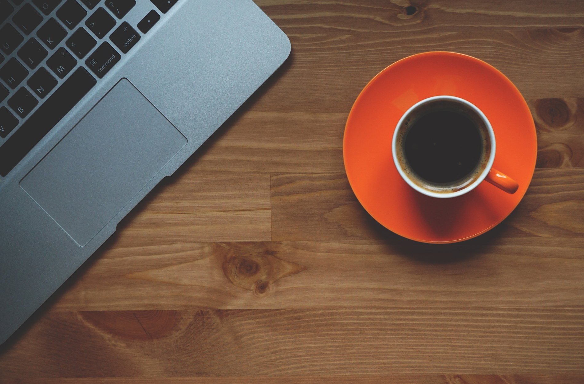 Image of a laptop and cup of coffee.